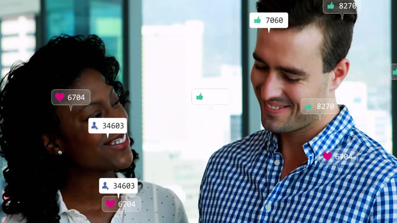 Woman holding phone and man tapping tablet, generating icons spreading across bodies for marketing