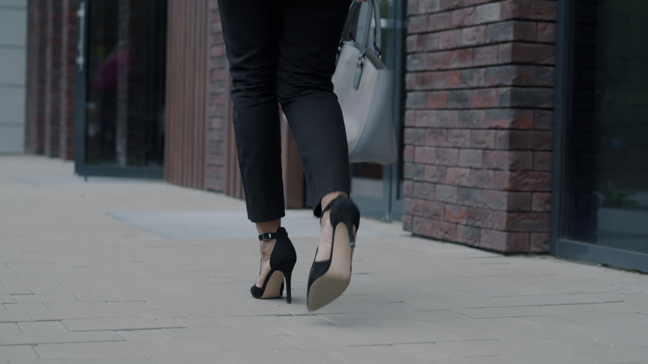 Businesswoman Walking Down the Street