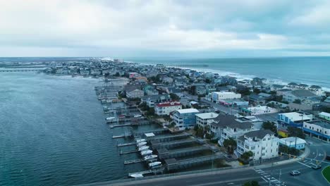 Lake-and-bridge-landscape-drone-aerial-shot-in-Wrightsville,-North-Carolina