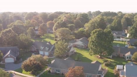 Aerial of drone UAV UAS in mid-air flight, carrying package for home delivery