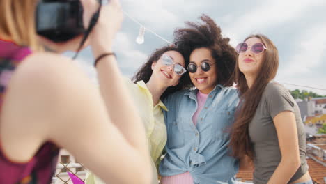 friends having fun on rooftop taking