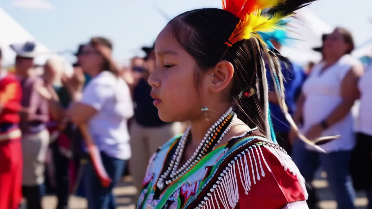 Young Native American girl in traditional attire at a cultural event