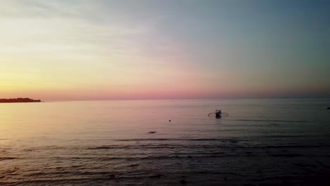 Indonesian-boat-on-a-beach-of-Gili-Air-island-in-Indonesia-during-sunset