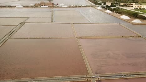 Drone-view-of-the-salt-lakes-at-Salina-Grande,-Sicliy,-Italy