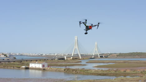 DJI Inspire Drone Camera Flying Outdoor In Portimao, Portugal. New Bridge Of Arade River In Background. wide shot