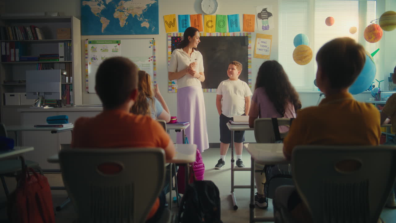 Elementary School Student Speaking About Energy Sources in Front of Classroom