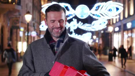 portrait of smiling man with a big gift