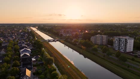 Aerial View of a Canal and Residential Area at Sunset