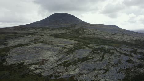 Aerial:-Rugged-land,-barren-arctic-hill-terrain-of-Spekdalen,-Norway