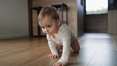 video of little girl crawling at home interior.