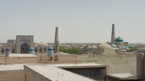 historic buildings in the old town of khiva in uzbekistan - panning