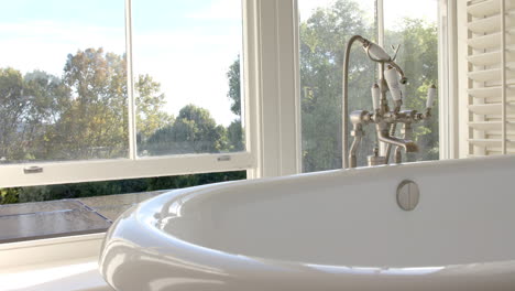 sunlight streaming through windows, lighting up bright bathroom, copy space