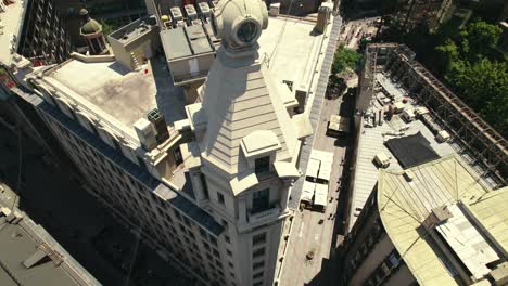 Aerial-view-tilt-down-establishing-over-the-Ariztia-building-in-La-Bolsa-neighborhood,-heritage-of-Santiago,-Chile