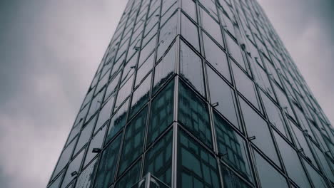 modern skyscraper corner with rain reflections