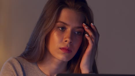 woman focused on laptop