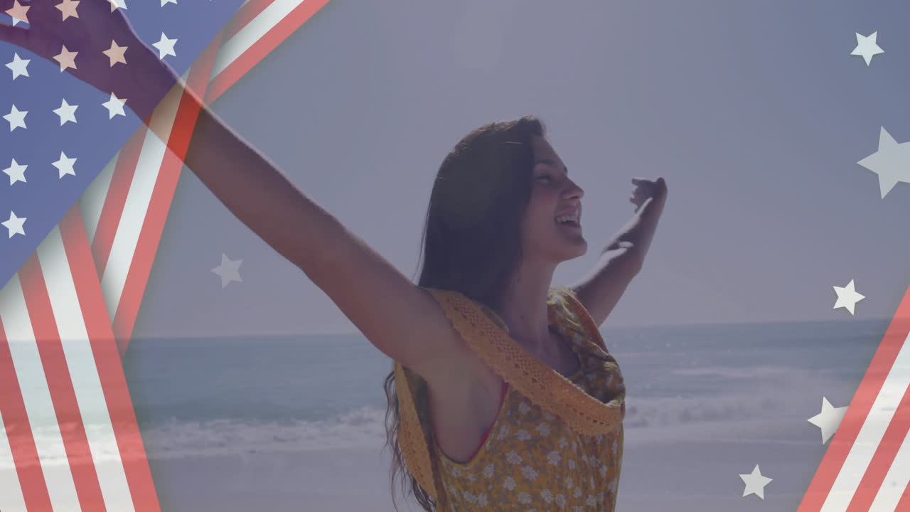 animación de bandera estadounidense sobre mujer con los brazos extendidos en la playa
