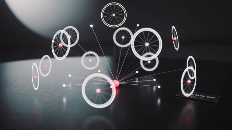 Turning small switch on, central red-lit puck projecting rotating ring wheels over dark table