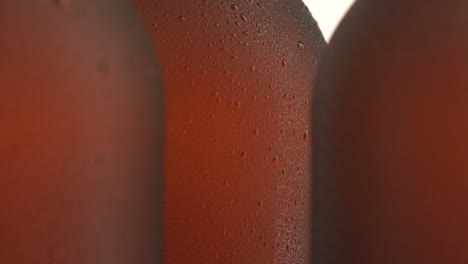 three beer bottle rotating on white background