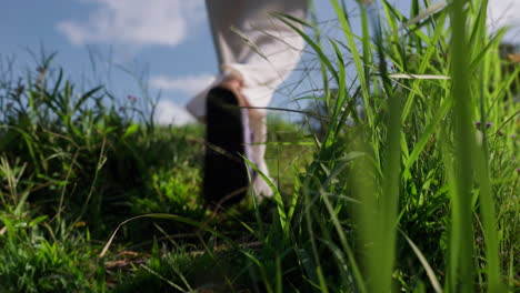 Low-angle-slomo-of-tourist-walking-and-exploring-lush-Tegalalang-Rice-Terrace