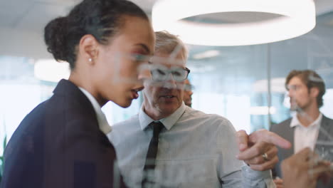 business people using sticky notes brainstorming team leader woman working with colleagues writing on glass whiteboard showing problem solving strategy in office meeting through glass