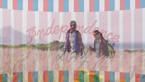 Animation-of-independence-day-text-over-smiling-diverse-couple-hiking