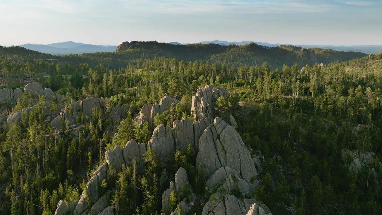 Sweeping aerial view showcasing rugged cliffs and deep valleys in the western United States.
