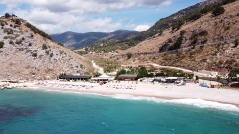 turquoise sea and beautiful llamani beach along coast of albania - aerial
