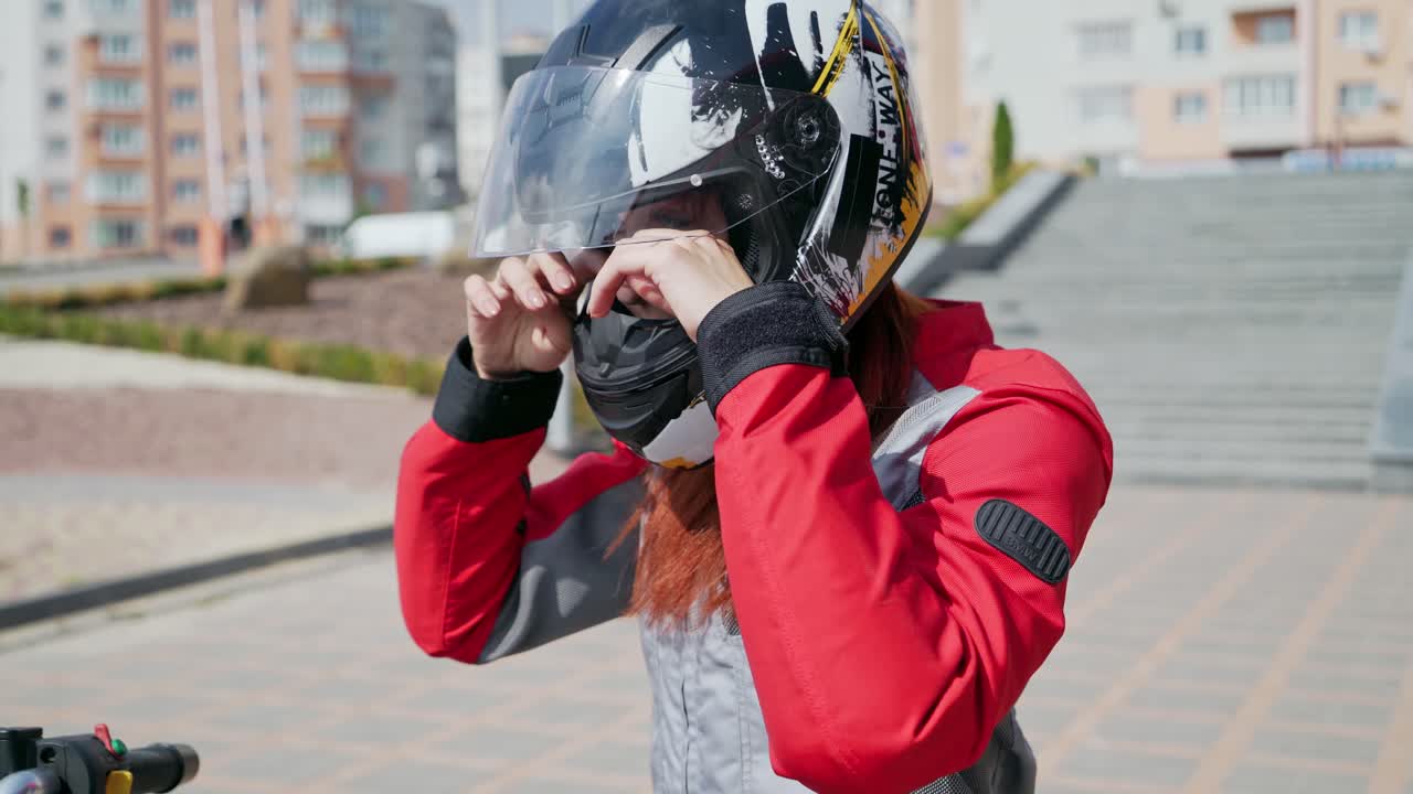 Fashion female biker. Sexy biker lady in leather jacket sits on motorbike