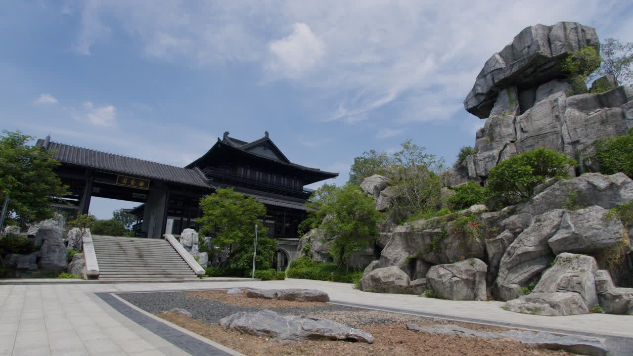 Grand entrance to Chinese oriental palace with oriental garden
