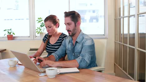 Casual-business-workers-using-laptop-computer