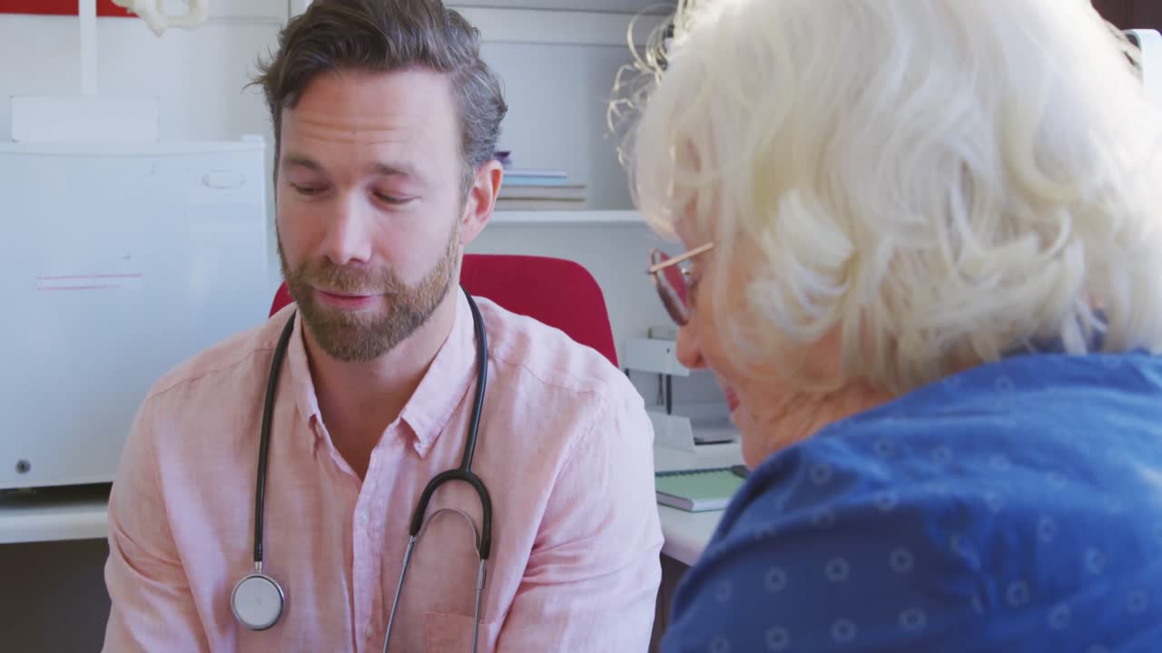 Doctor examining a senior woman in a retirement home