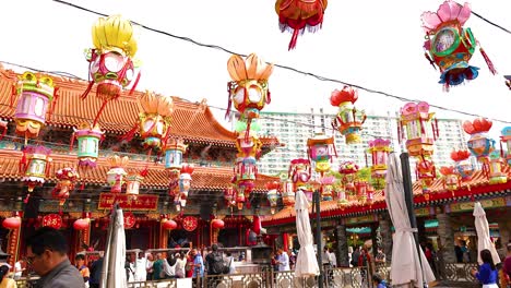 colorful lanterns sway at hong kong temple