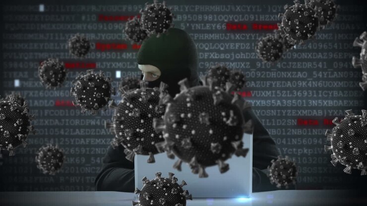Animation of of macro covid19 cells over man wearing balaclava, using a laptop
