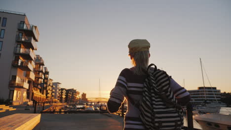 Active-Woman-Rejoices-At-Sunrise-Over-The-Marina-Runs-Forward-Raises-His-Hands-Up-Sunrise-In-Bergen