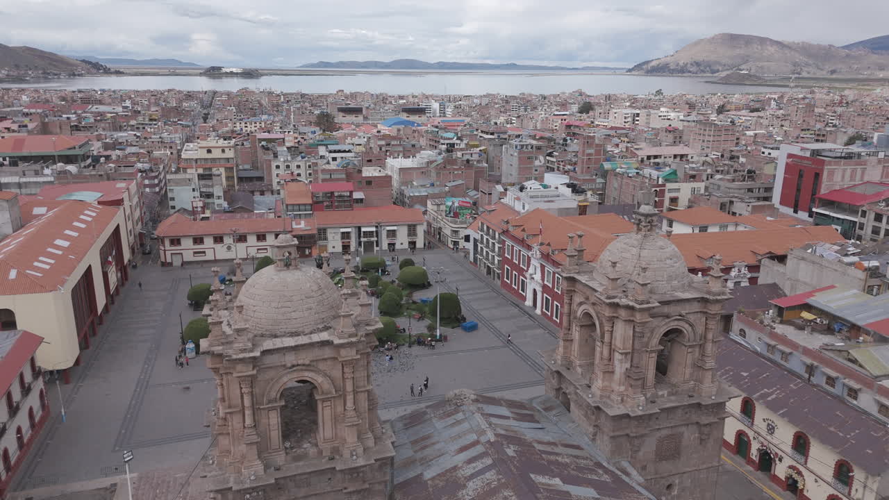 Drone shot above Plaza Mayor de Puno Peru near the church or cathedral LOG