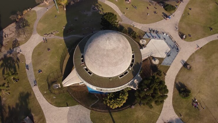 Aerial orbit shot over Planetarium at Parque Tres de Febrero during sunset,4K
