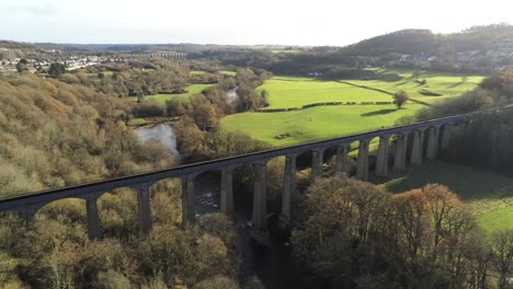 old welsh pontcysyllte aqueduct waterway aerial view rural autumn woodlands valley descending left