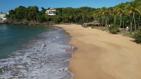 woman walks along the beach. tracking shot