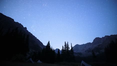 a timelapse of the stars and mountains at high elevation in the fall in montana