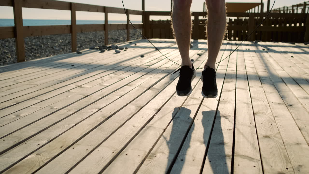 Man Jumping Rope on a Wooden Pier