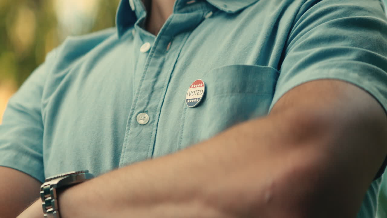 A man with an 'I Voted' pin