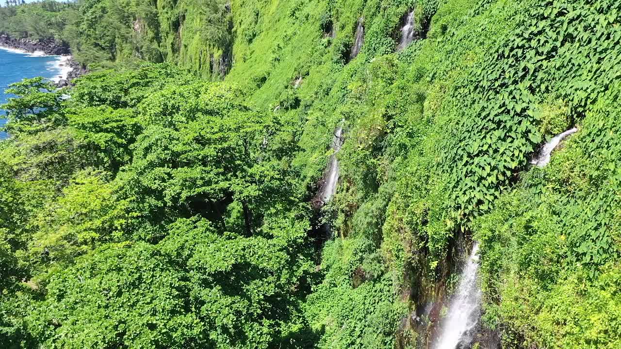 Aerial drone view of the Anse des Cascades waterfalls on Reunion Island, a french overseas department in the Indian Ocean