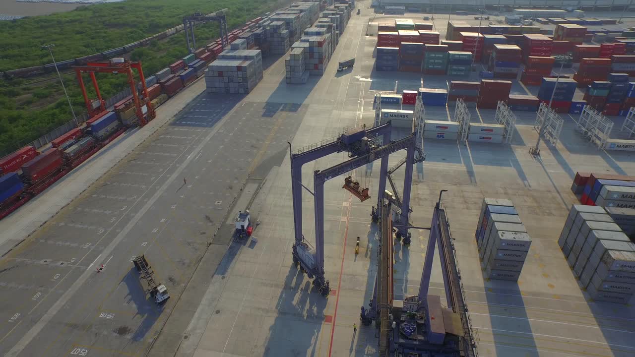 Aerial shot of a big crane moving in a port