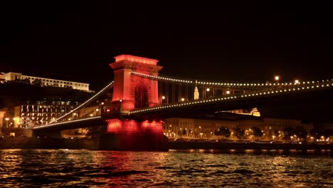 iconic chain bridge over the danube river illuminated with night light, hungary