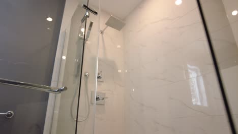 modern bathroom pov look at tub then go into standup shower real estate smooth gimbal