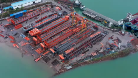 industrial factory real shot of shipbuilding and ship repair yard. shipyard contains many cranes, dry docks, slipways, warehouses, painting facilities and large areas for fabrication of ships