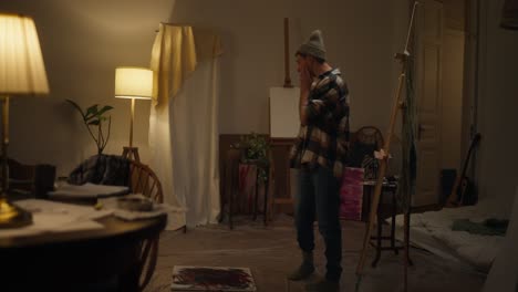 artist in a nighttime studio