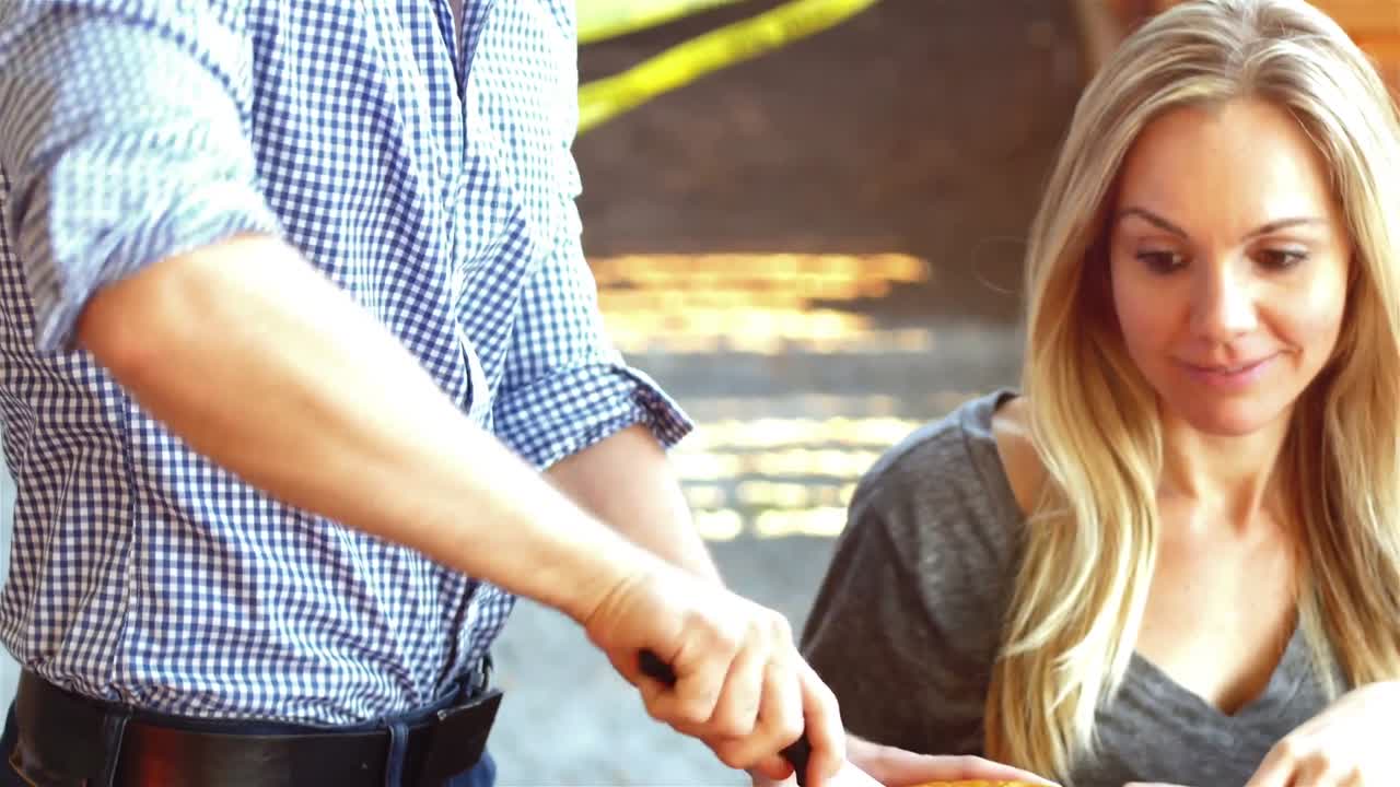 Man carving a pumpkin to make halloween lantern