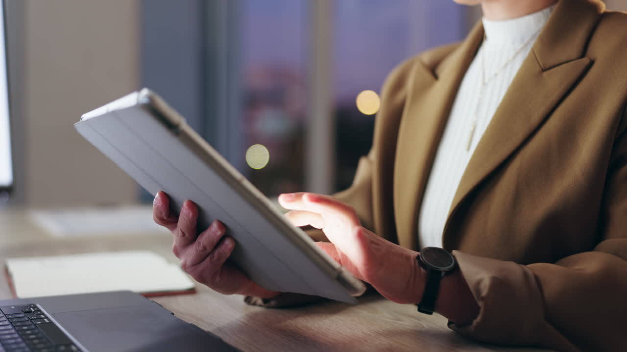 Businesswoman using a tablet at her desk