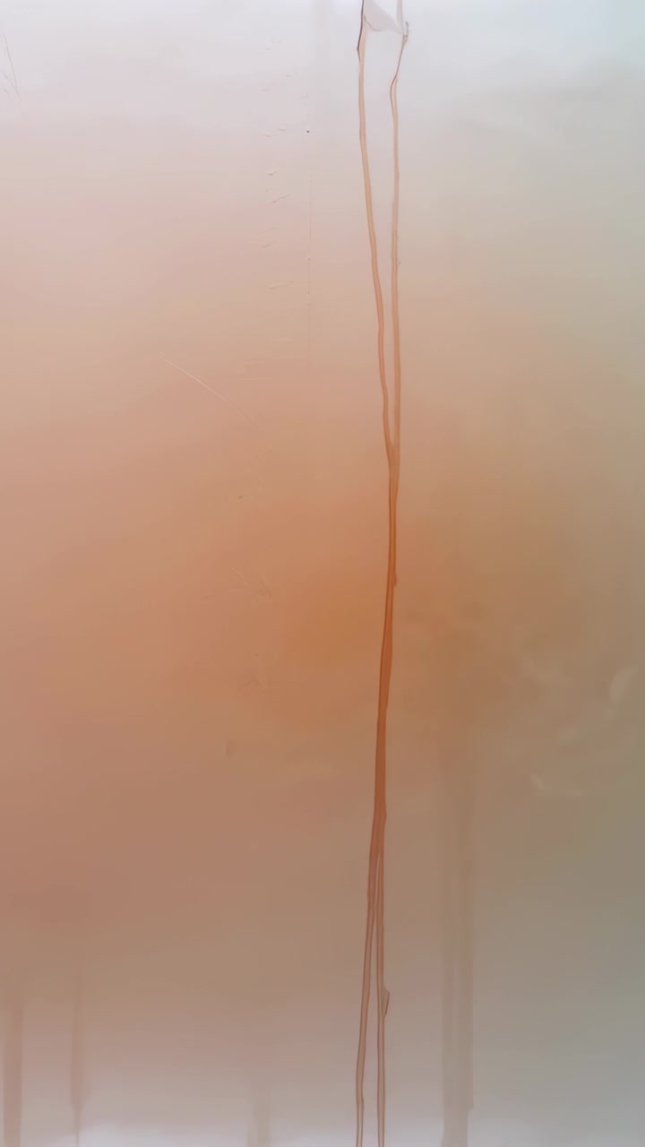 Vertical video: Panning camera centering on filaments stuck on shower glass, showing tab and drips